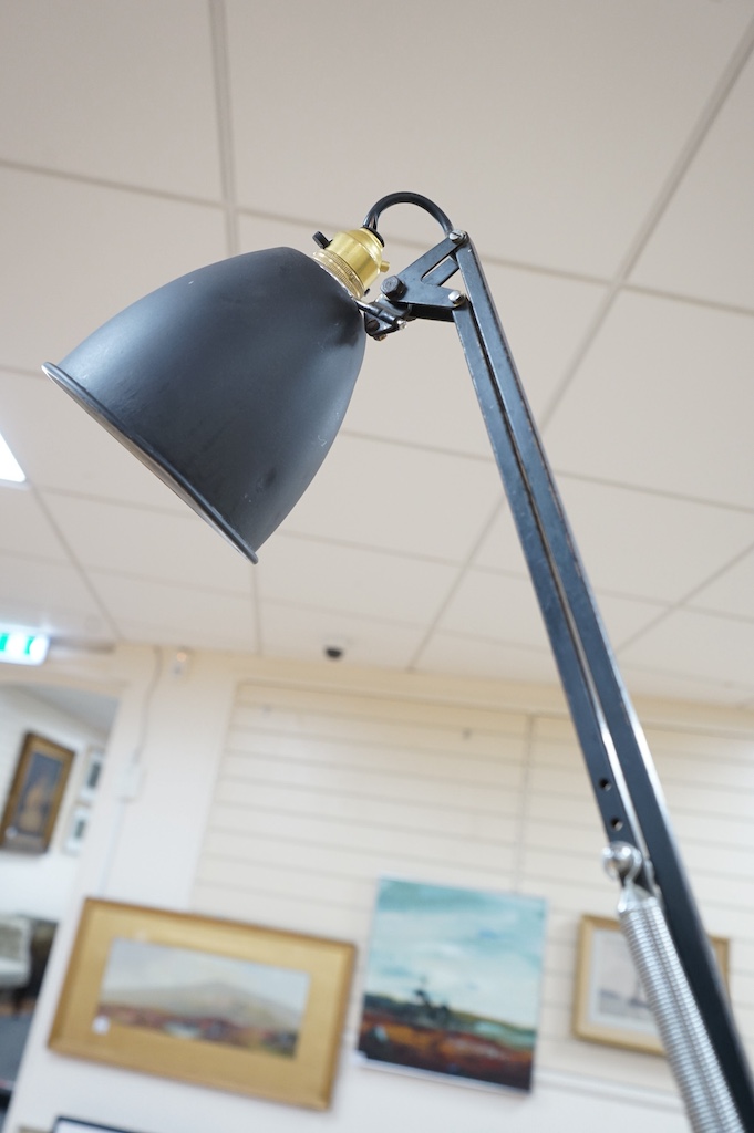 A mid century architect's black metal angle poise desk lamp, 110cm high. Condition - fair to good, not tested